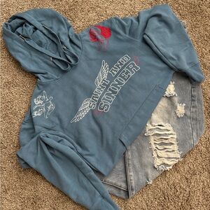 Blue Graphic Hoodie with Distressed Jeans